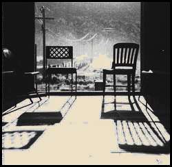Photo of two chairs in a doorway.
